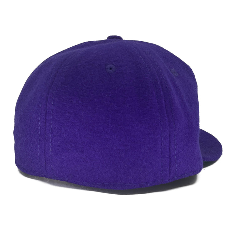 The EFF Texas Christian University 1963 Vintage Ballcap, made of genuine wool in purple, is shown from the back with visible stitching and a partially visible flat brim on the right side.