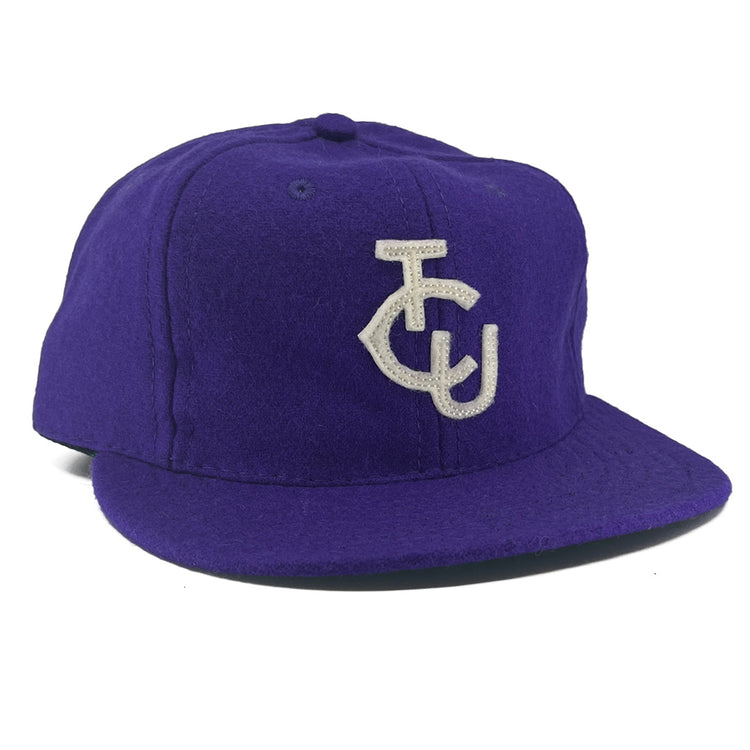 The EFF Texas Christian University 1963 Vintage Ballcap is a genuine purple wool flat-brim hat with a white TCU monogram—ideal for fans seeking an authentic TCU ballcap.
