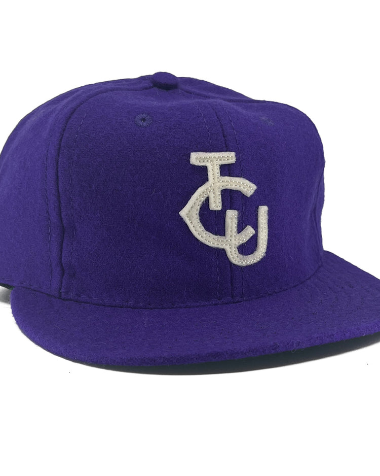 The EFF Texas Christian University 1963 Vintage Ballcap is a genuine purple wool flat-brim hat with a white TCU monogram—ideal for fans seeking an authentic TCU ballcap.