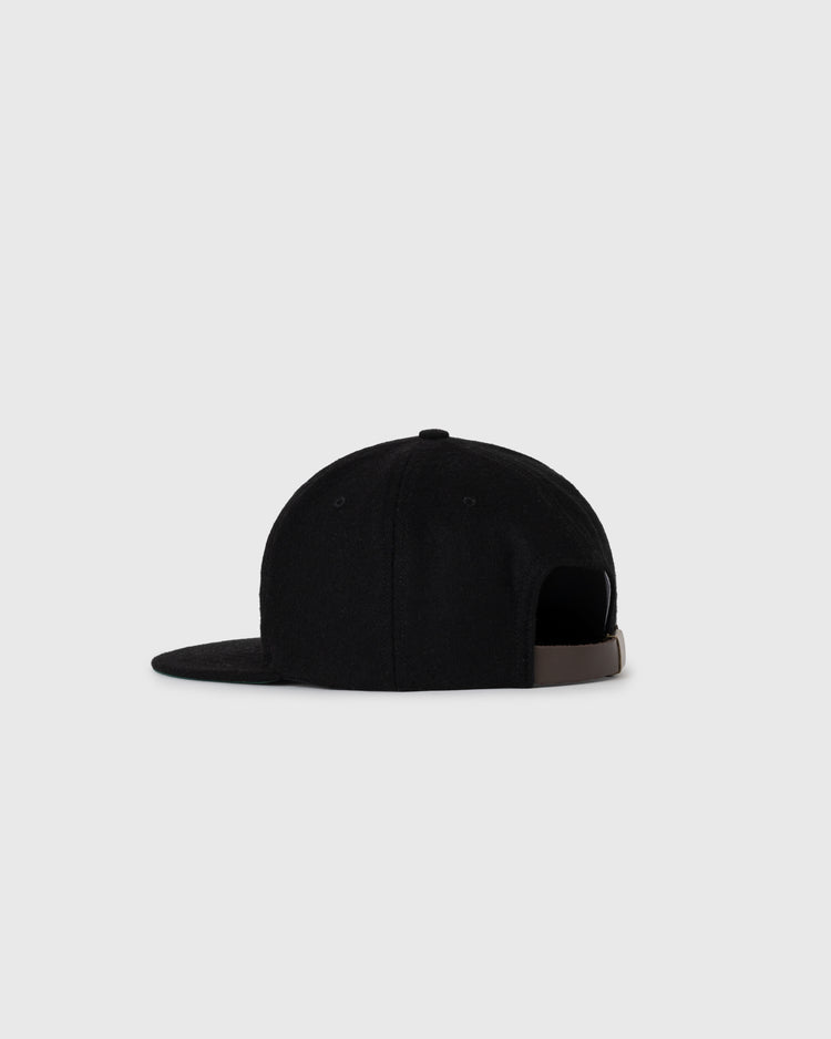 The EFF Tokyo Kyojin (Giants) 1940 Authentic Wool Softbrim Ballcap is shown from the back on a light gray background, featuring black wool, a flat brim, and an adjustable brown strap closure.