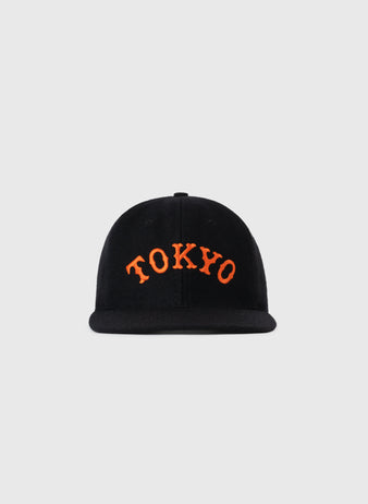 The EFF Tokyo Kyojin (Giants) City Series Wool Ballcap is a black cap with bold, curved orange TOKYO lettering on the front, shown against a plain light gray background.
