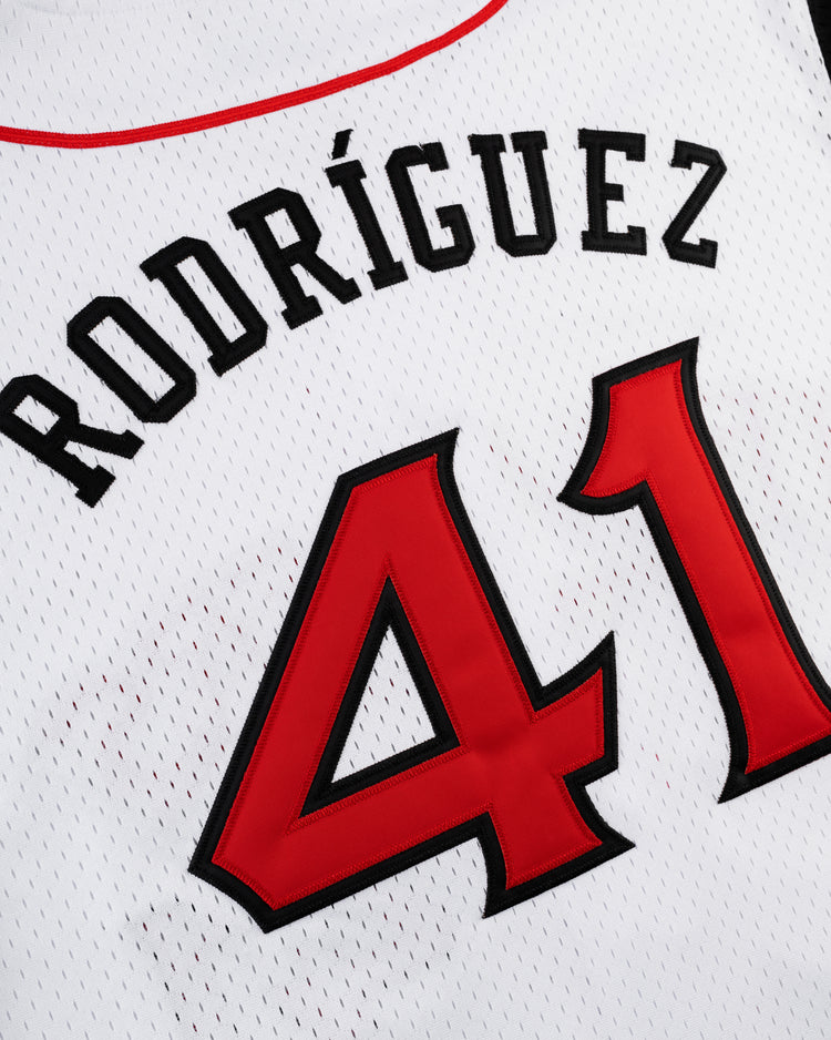 A close-up of the Ebbets Field JULIO RODRIGUEZ BUTTON UP MESH JERSEY WHT/BLK, featuring RODRÍGUEZ and the number 41 in bold red and black letters on white mesh fabric.