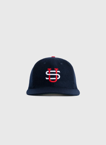 The EFF US Tour Of Japan 1934 Authentic Wool Ballcap features a navy blue color and a red and white interlocking US logo, echoing the classic Babe Ruth era style, shown on a plain light gray background.