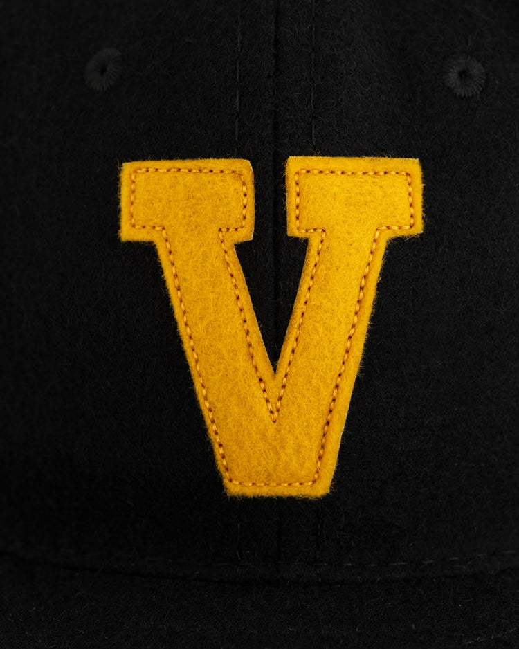 The EFF Vanderbilt University 1960 Authentic Wool Ballcap features a black vintage style and a bold yellow V on the front—perfect for any Commodores fan.