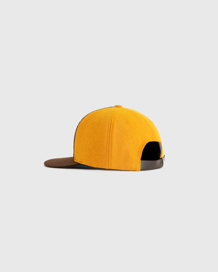 The EFF Walla Walla Padres 1974 Authentic Wool Ballcap features yellow wool, a brown brim, and an adjustable strap, replicating the classic Northwest League design. Shown on a plain light gray background.