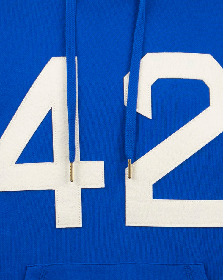 Close-up of the EFF Jackie Robinson French Terry Script Hooded Sweatshirt in royal blue, featuring bold white 42 on the front and metal-tipped blue drawstrings, crafted from soft French terry.