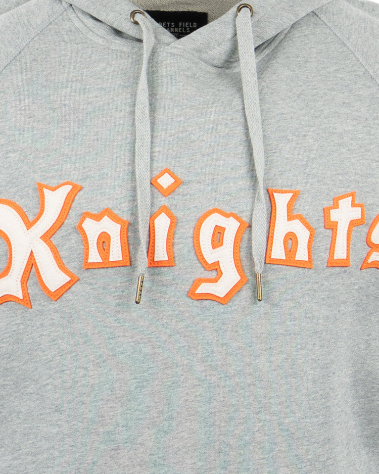 The EFF New York Knights French Terry Script Hooded Sweatshirt features Knights in bold, orange-outlined, white medieval letters—ideal for fans of Roy Hobbs or The Natural.