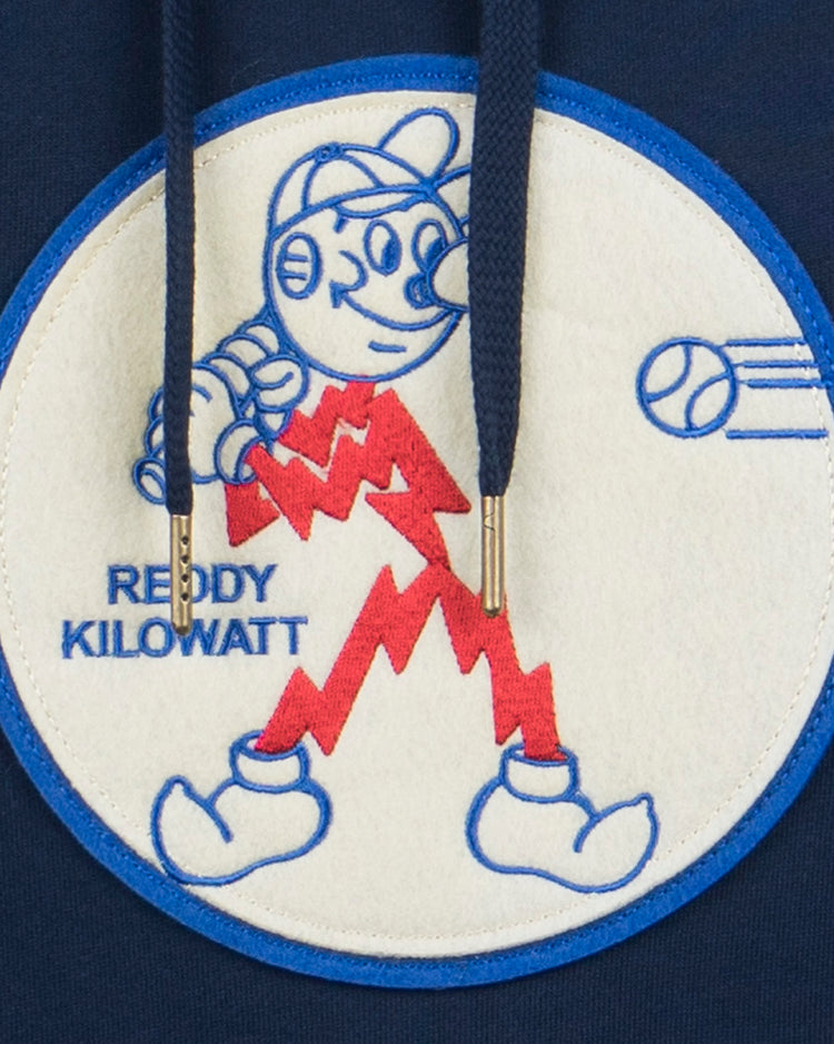 The EFF Reddy Kilowatt French Terry Script Hooded Sweatshirt in navy blue features the electric mascot Reddy Kilowatt—lightbulb head, red lightning bolt body—holding a baseball glove with “REDDY KILOWATT” in blue text.