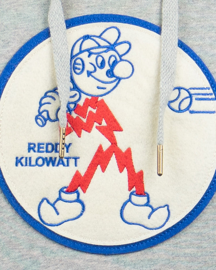 The EFF Reddy Kilowatt French Terry Script Hooded Sweatshirt in gray features a circular patch of Reddy Kilowatt with red lightning bolts, blue outline, hat, and baton. REDDY KILOWATT is on the left; two gray drawstrings hang over the patch.