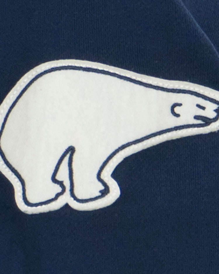 A white polar bear outline patch with blue stitching, inspired by Polar brand beer, is sewn onto the dark blue Cerveceria Polar French Terry Script Hooded Sweatshirt by EFF.
