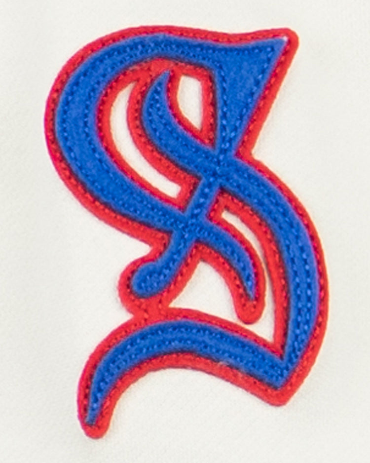 The EFF Santurce Cangrejeros French Terry Script Hooded Sweatshirt in Natural features a blue and red stylized S patch with intricate curves, inspired by the Puerto Rican League’s dynamic spirit.