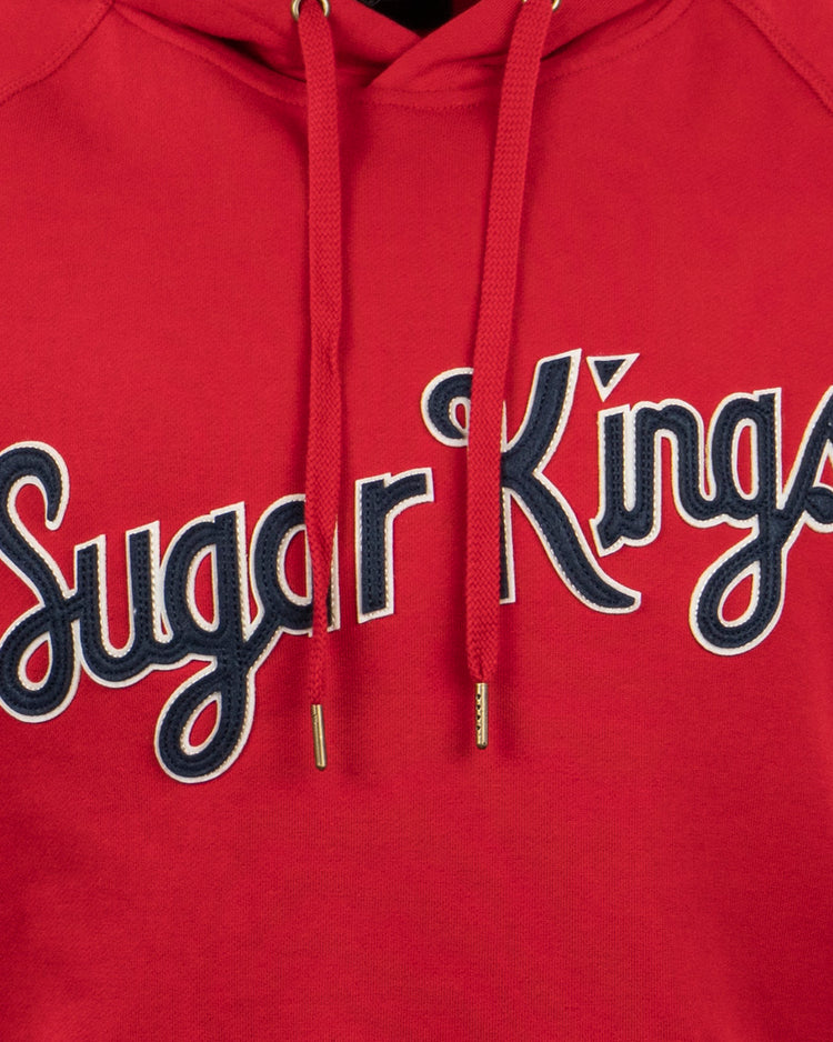 The EFF Havana Sugar Kings French Terry Script Hooded Sweatshirt features “Sugar Kings” in white and black script on the front, inspired by Havana baseball heritage, with two red drawstrings finished in gold tips.