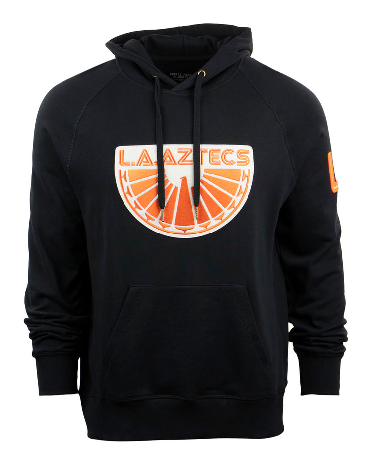 The EFF Los Angeles Aztecs French Terry Script Hooded Sweatshirt is a black hoodie with a front pocket, bold orange and white sunburst logo, and a small orange patch on the left sleeve—honoring the iconic NASL era.