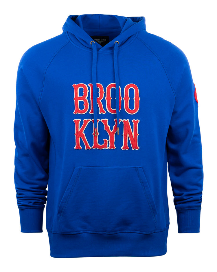 EFF’s Brooklyn Royal Giants French Terry Script Hooded Sweatshirt in blue features red and white BROOKLYN lettering on the chest, a front pocket, drawstrings, and is crafted from soft heavyweight cotton for comfort.
