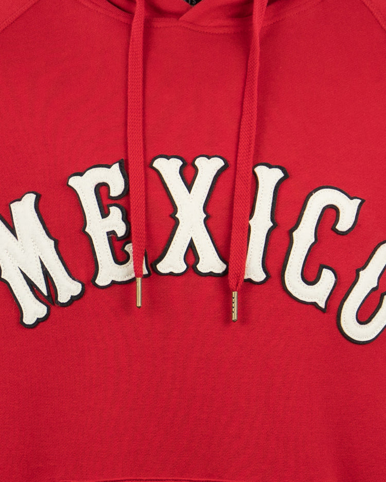 The EFF Mexico City Red Devils French Terry Script Hooded Sweatshirt features bold white MEXICO lettering outlined in black on a red hoodie, with gold-tipped red drawstrings—a perfect choice for Mexican baseball fans.