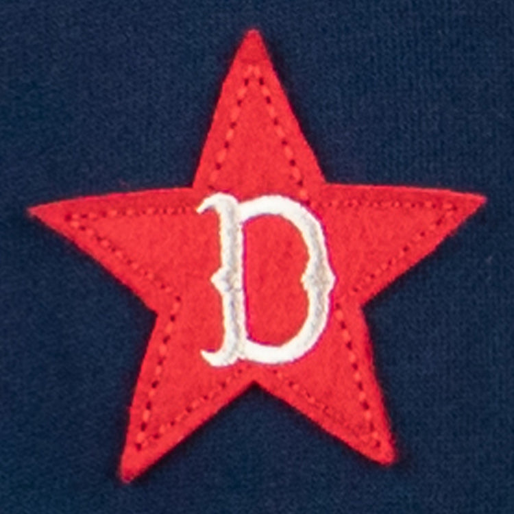 The EFF Detroit Stars French Terry Script Hooded Sweatshirt features a red five-pointed star with a white, ornate “D” at the center on a dark blue background, inspired by the classic Negro Leagues Detroit Stars emblem.