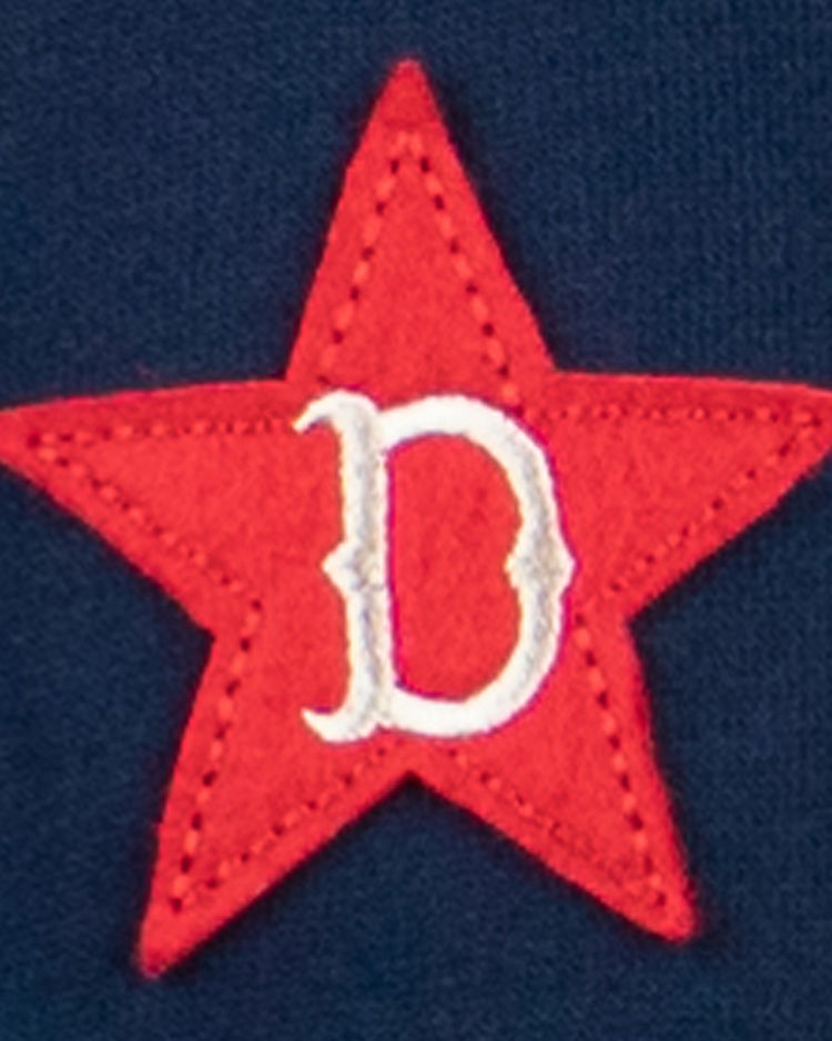 The EFF Detroit Stars French Terry Script Hooded Sweatshirt features a red five-pointed star with a white, ornate “D” at the center on a dark blue background, inspired by the classic Negro Leagues Detroit Stars emblem.