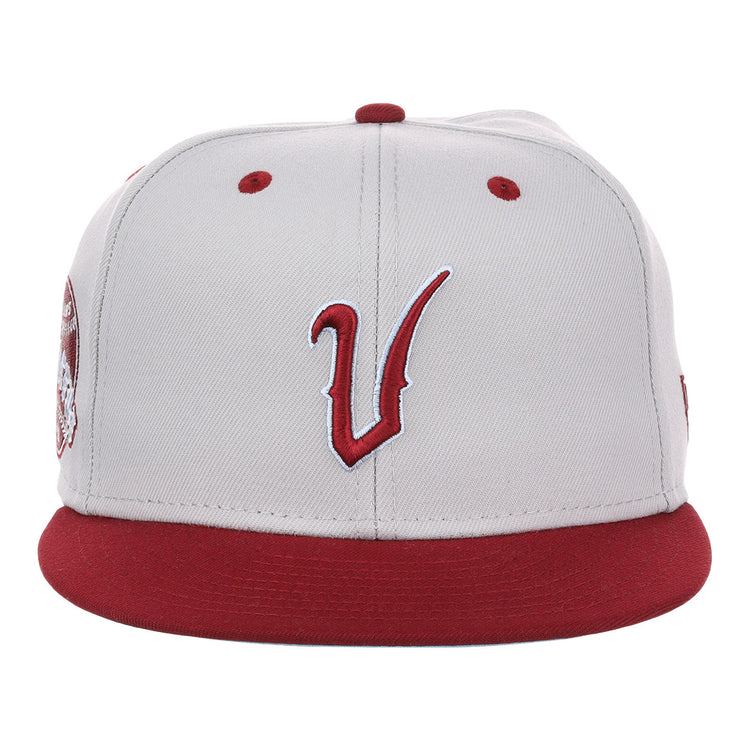 The EFF Veracruz Azules NLB Storm Chasers Fitted Ballcap features a storm gray crown, red brim, bold red vents, and a stylized red and white V embroidered on the front for a vintage-inspired look.