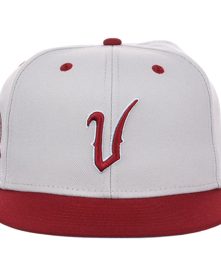 The EFF Veracruz Azules NLB Storm Chasers Fitted Ballcap features a storm gray crown, red brim, bold red vents, and a stylized red and white V embroidered on the front for a vintage-inspired look.