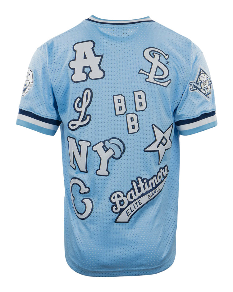 The EFF Negro League Allover Vintage Inspired NL Replica V-Neck Mesh Jersey in light blue features oversized white and navy team initials and logos, including A, NY, SD, and Baltimore Elite Giants, scattered across the back.