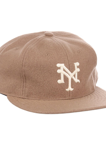 The EFF New York Cubans Vintage Inspired Ballcap features a light brown design, curved brim, and embroidered white NY logo, taking inspiration from classic styles like the Orestes Minoso cap.