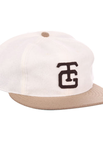 The EFF Tokyo Kyojin (Giants) Vintage Inspired Ballcap in cream features a beige brim, brown top button, and bold black overlapping TC logo—paying tribute to the classic Tokyo Giants tradition.