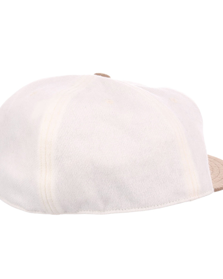 The EFF Tokyo Kyojin (Giants) Vintage Inspired Ballcap in cream features visible stitching and a light beige brim, shown from the back and side on a white background, channeling classic style inspired by the iconic Tokyo Giants.