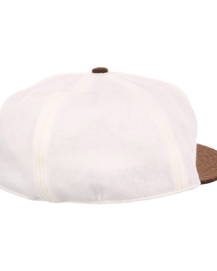The EFF Chicago Cats Vintage Inspired Ballcap is a white newsboy cap with a brown button and textured brim, shown from a rear side angle on a plain white background.