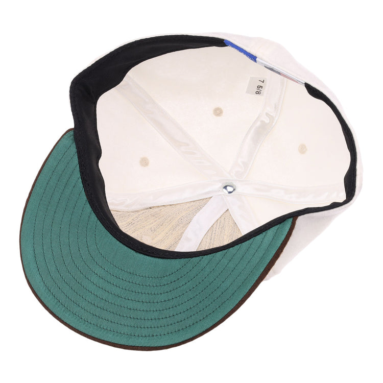 A top-down view of the EFF Chicago Cats Vintage Inspired Ballcap shows a green underbill, black trim, white interior panels with ventilation holes, and a fabric size tag labeled 7 5/8.
