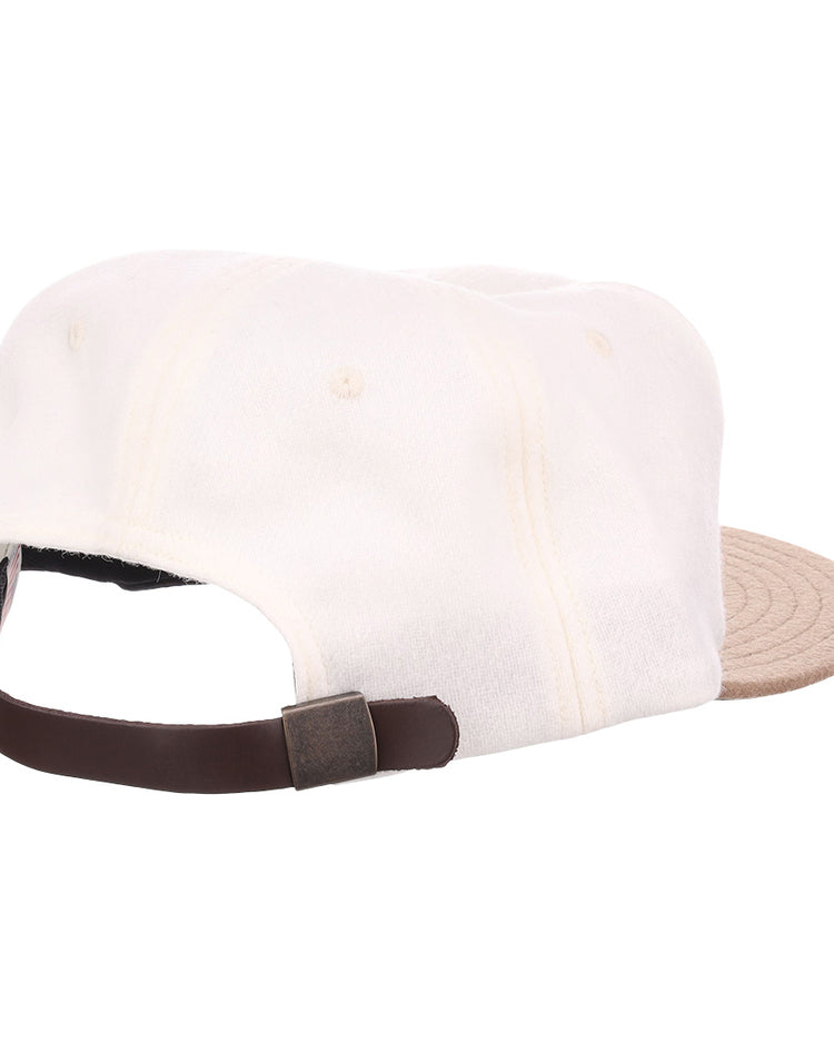 The EFF Tokyo Kyojin (Giants) Vintage Inspired Ballcap in cream has a beige brim and a dark brown adjustable strap with metal buckle, shown from the back on a plain white background—ideal for any Giants fan.