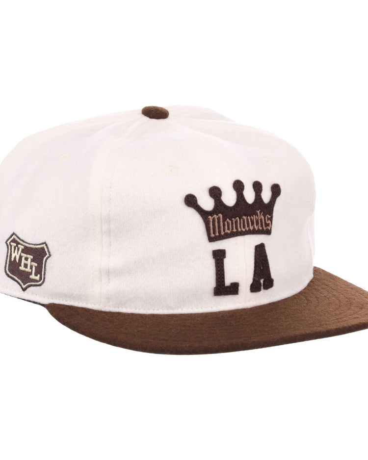 The EFF Los Angeles Monarchs Vintage Inspired Ballcap is a white wool cap with a brown brim, featuring Monarchs LA and crown logo on the front and a WHL shield patch on the side.
