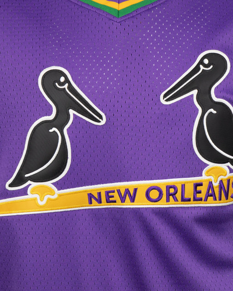 The EFF New Orleans Black Pelicans Vintage Inspired NL Replica V-Neck Mesh Jersey features a purple mesh design with two black and white pelicans on a yellow bat and NEW ORLEANS in yellow and blue, honoring the classic team.