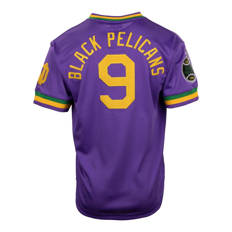 The EFF New Orleans Black Pelicans Vintage Inspired NL Replica V-Neck Mesh Jersey is purple with yellow trim, features BLACK PELICANS and a yellow number 9 on the back, green/gold stripes, and a team patch on the left sleeve.