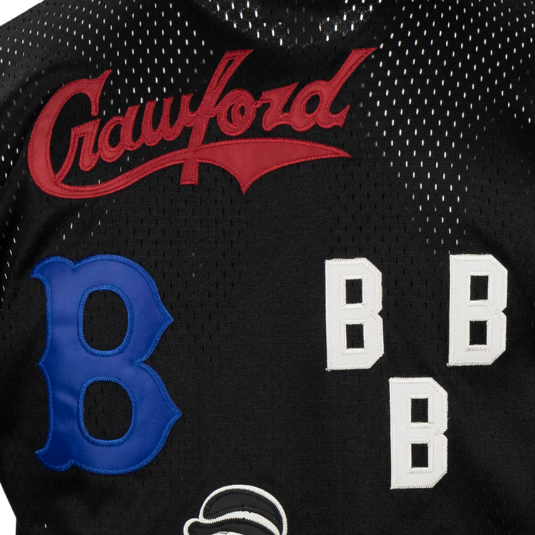 Close-up of the EFF Negro League Allover Vintage Inspired NL Replica V-Neck Mesh Jersey in black, featuring red Crawford script, a large blue B, three white block Bs, and part of another patch—a tribute to Negro League Baseball.