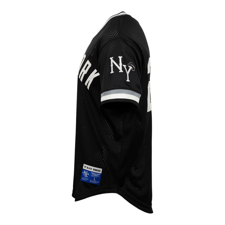 EFF New York Black Yankees Vintage Inspired NL Replica V-Neck Mesh Jersey in black, shown from the side with a white NY sleeve logo, white cuff stripes, and partially visible NEW YORK lettering—honoring Negro National League history.