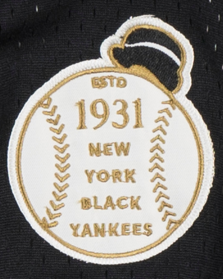 The EFF New York Black Yankees Vintage Inspired NL Replica V-Neck Mesh Jersey features a black baseball patch with gold stitching, ESTD 1931 NEW YORK BLACK YANKEES text, a black top hat, and honors their Negro National League legacy.