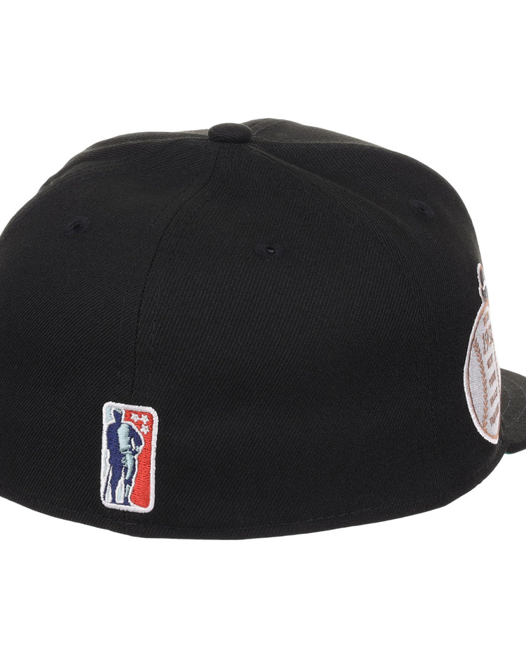 The EFF New York Black Yankees NLB Flip Fitted Ballcap features a black design with a small embroidered bat-bearing silhouette near the back edge, honoring the legacy of the Negro National League team.