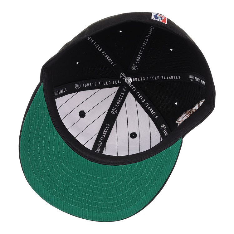The New York Black Yankees NLB Flip Fitted Ballcap by EFF features a black crown, green brim, white pinstriped lining, and black bands labeled EBBETS FIELD FLANNELS. An MLB logo patch at the back honors the Negro National League legacy.