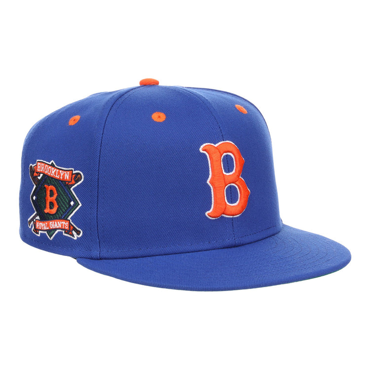 The EFF Brooklyn Royal Giants NLB Flip Fitted Ballcap is a vintage-inspired royal blue cap featuring a bold 3D embroidered orange B on the front and a side patch with Brooklyn Royal Giants and an orange B.