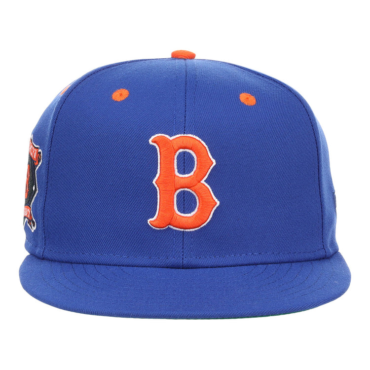 The EFF Brooklyn Royal Giants NLB Flip Fitted Ballcap is a vintage-inspired royal blue cap with a bold orange 3D embroidered ‘B’ on the front, orange top button and eyelets, and a vibrant patch on the left side.