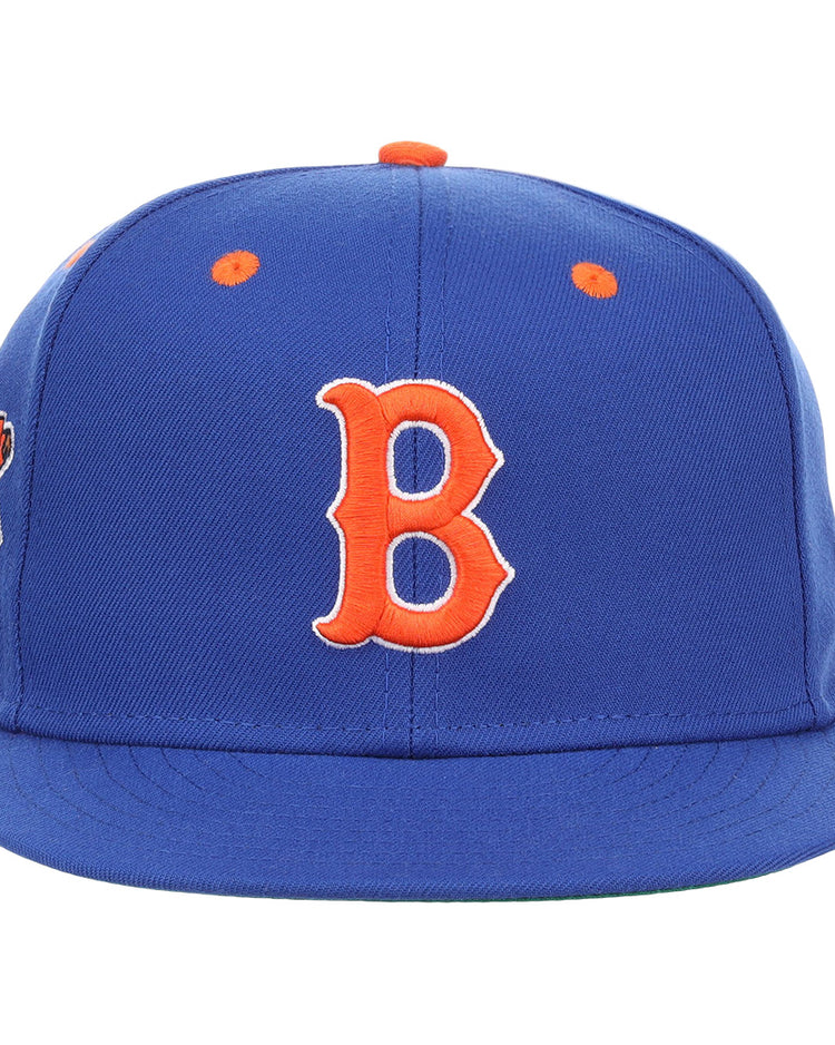 The EFF Brooklyn Royal Giants NLB Flip Fitted Ballcap is a vintage-inspired royal blue cap with a bold orange 3D embroidered ‘B’ on the front, orange top button and eyelets, and a vibrant patch on the left side.