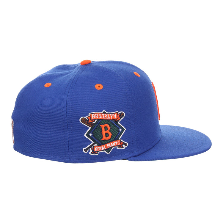 The EFF Brooklyn Royal Giants NLB Flip Fitted Ballcap is vintage-inspired in royal blue, with an orange top button and a 3D logo patch featuring a large B, two crossed bats, and Brooklyn Royal Giants.