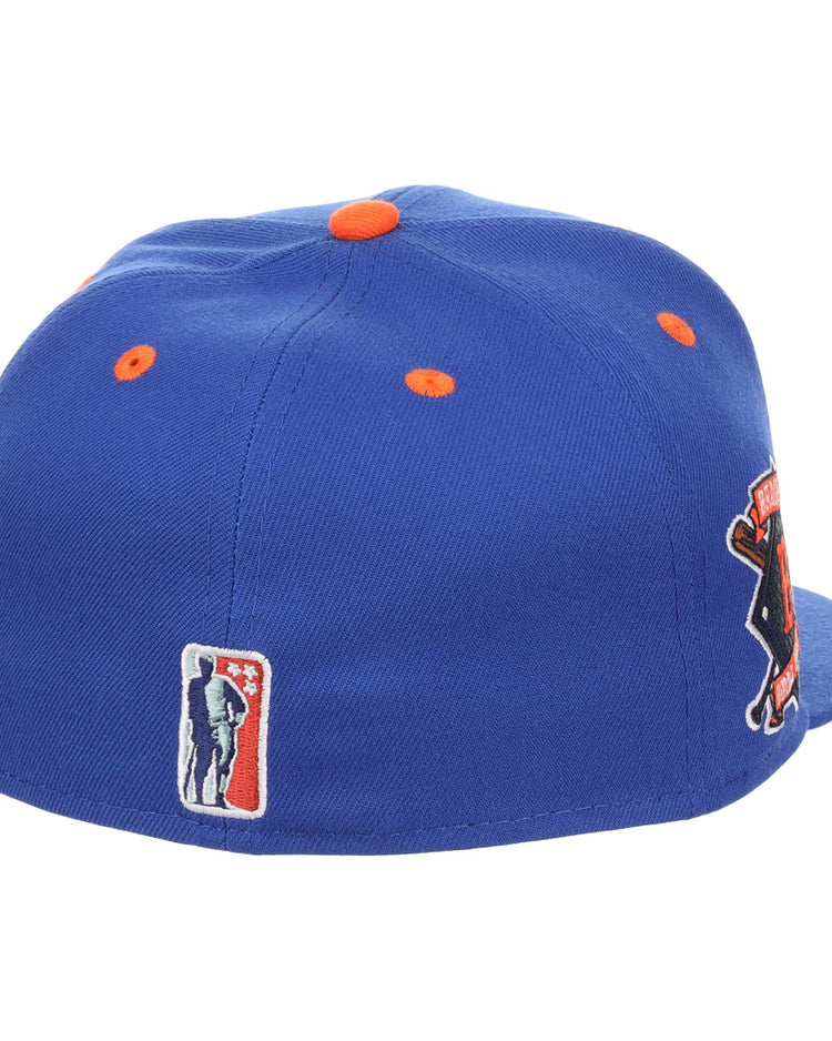 The EFF Brooklyn Royal Giants NLB Flip Fitted Ballcap features royal blue fabric with orange accents, a black and orange 3D side patch, and a small rectangular baseball player logo on the back. Shown from back and side angles.