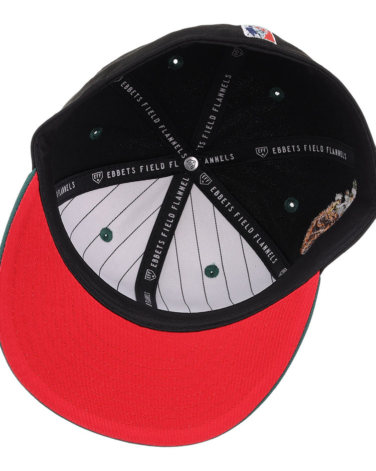 The Veracruz Azules NLB Flip Fitted Ballcap by EFF is shown from below, featuring a red brim, black sweatband with EBBETS FIELD FLANNELS text, green button accents, and white pinstripe lining—a nod to Veracruz and the Mexican League.