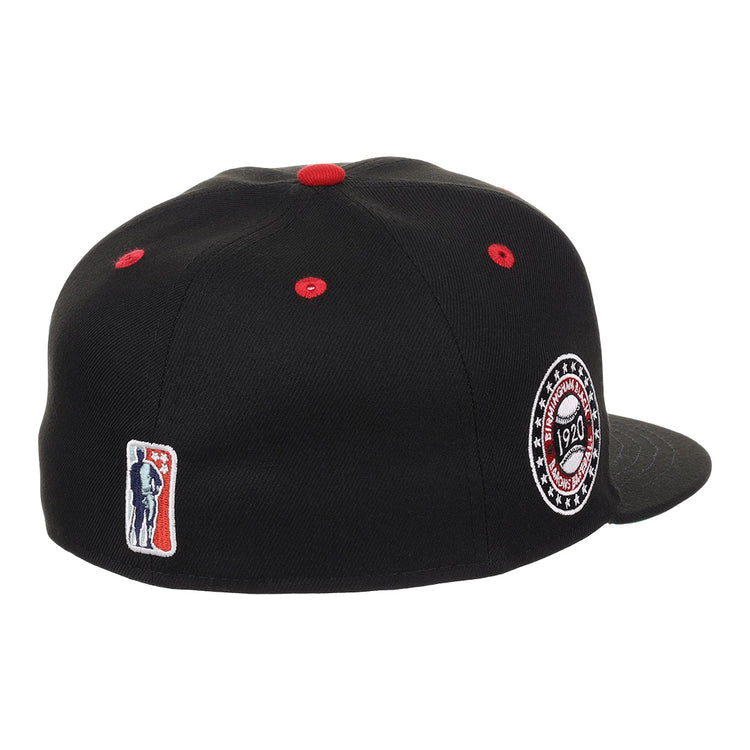 The EFF Birmingham Black Barons NLB Flip Fitted Ballcap features black fabric, red stitching, a side patch embroidered with 1920, and a small red, white, and blue batter logo on the back—honoring the Negro National Leagues legacy.