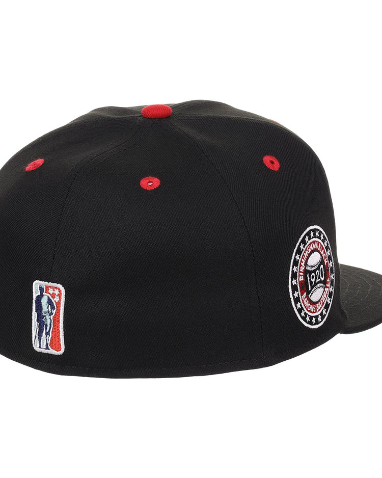 The EFF Birmingham Black Barons NLB Flip Fitted Ballcap features black fabric, red stitching, a side patch embroidered with 1920, and a small red, white, and blue batter logo on the back—honoring the Negro National Leagues legacy.