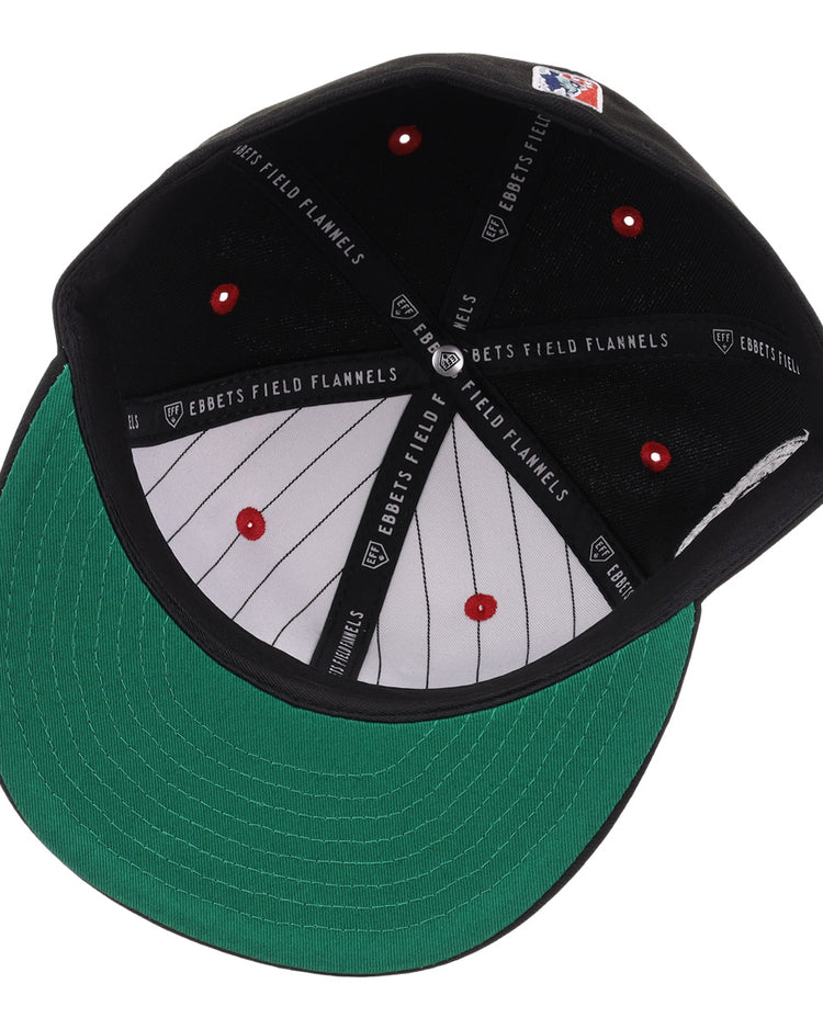 The EFF Birmingham Black Barons NLB Flip Fitted Ballcap features a black exterior, green underbrim, gray pinstriped interior, red button detail, black EBBETS FIELD FLANNELS taping, and honors the Negro National League legacy.