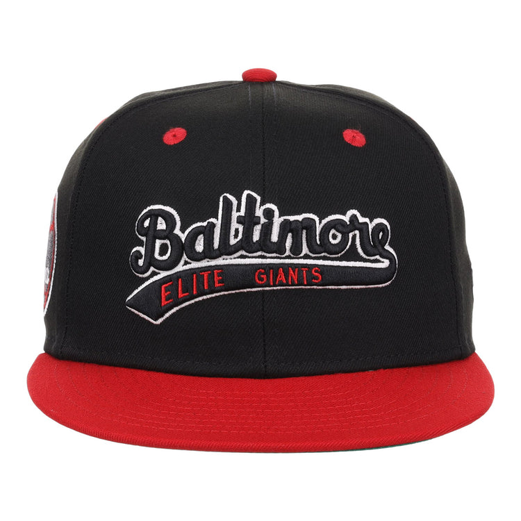 The EFF Baltimore Elite Giants NLB Flip Fitted Ballcap is a black vintage cap with a red brim, featuring Baltimore Elite Giants embroidered in white and red, honoring the storied Negro National League team.