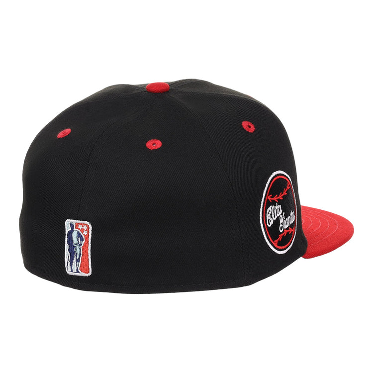 The EFF Baltimore Elite Giants NLB Flip Fitted Ballcap features a black crown, red brim and button, a circular side patch with white and red embroidery inspired by the Negro National League, and a small embroidered batter logo on the back.
