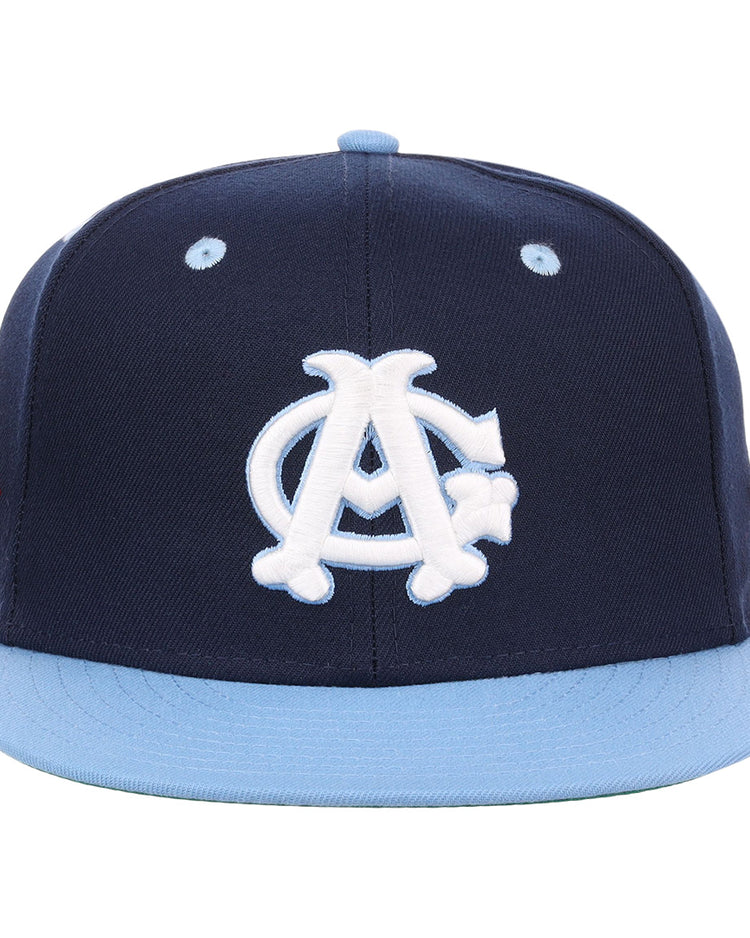 The EFF Chicago American Giants NLB Flip Fitted Ballcap features a navy crown, light blue brim, white intertwined A and C logo on the front, side patch, and vintage Negro League style.